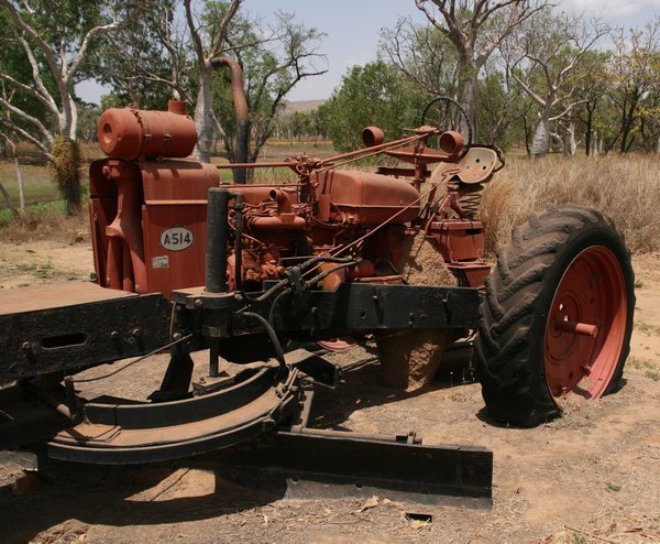The tractor at Parry's Creek Farm with ingrowing termite mound