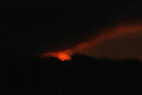 The glow from the bush fire in the distance late at night