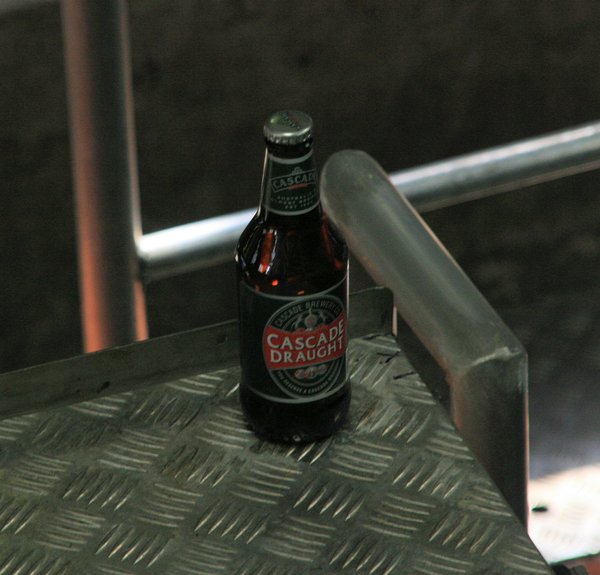 The lone bottle on the conveyor which was not whizzing!
