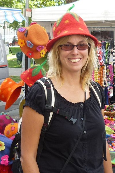 Trying on hats at the market