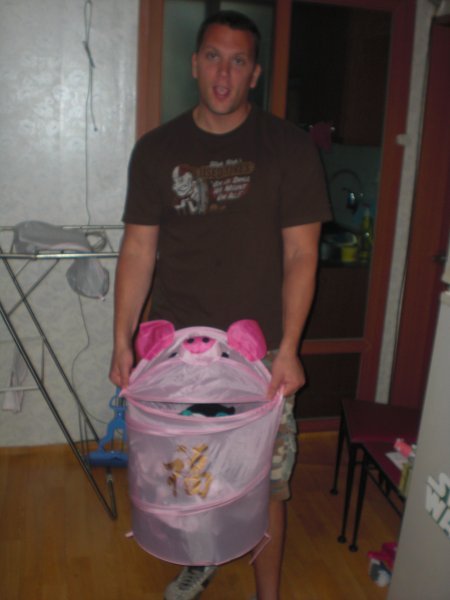 Adam loves his new pig laundry basket