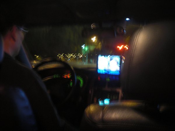 In the Taxi, yes, he is watching T.V. while driving like a maniac.