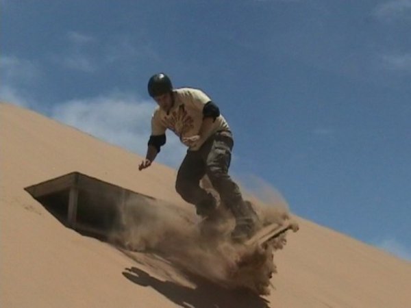 Mark attempts some nifty moves on the sandboard