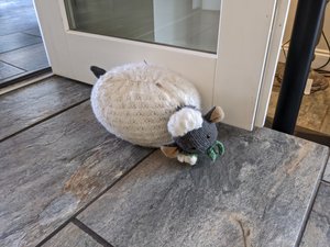 Upside down lamb door stopper resembling Jo and her ditch side fall
