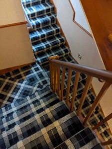 the tartan covered stairs at the guest house