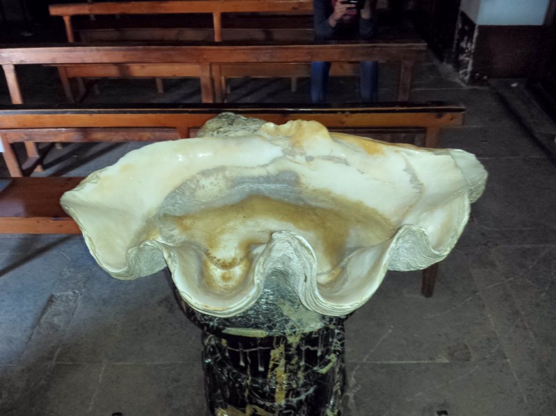 An unusual oyster shell shaped baptismal fount