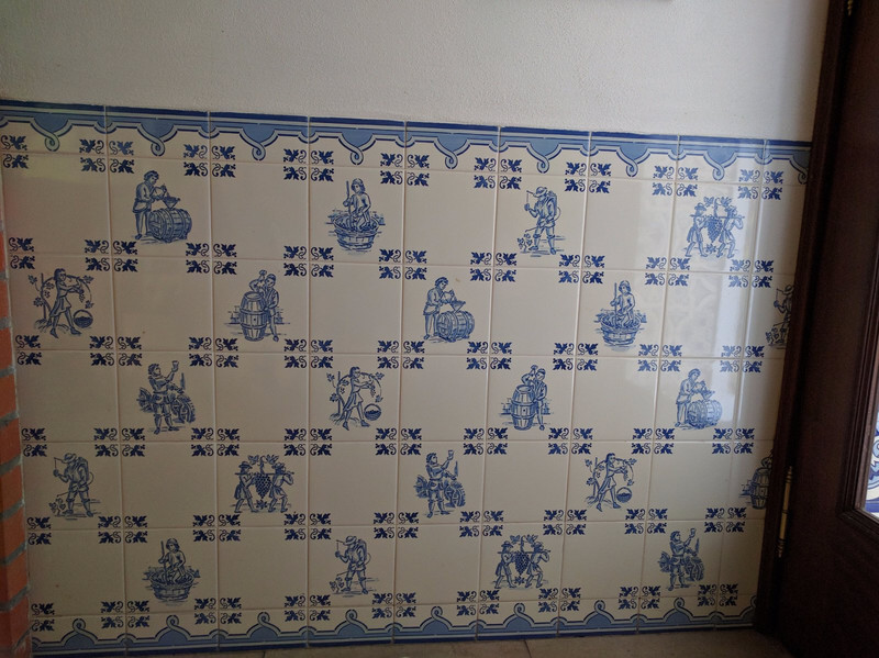 Tiles showing process of wine making