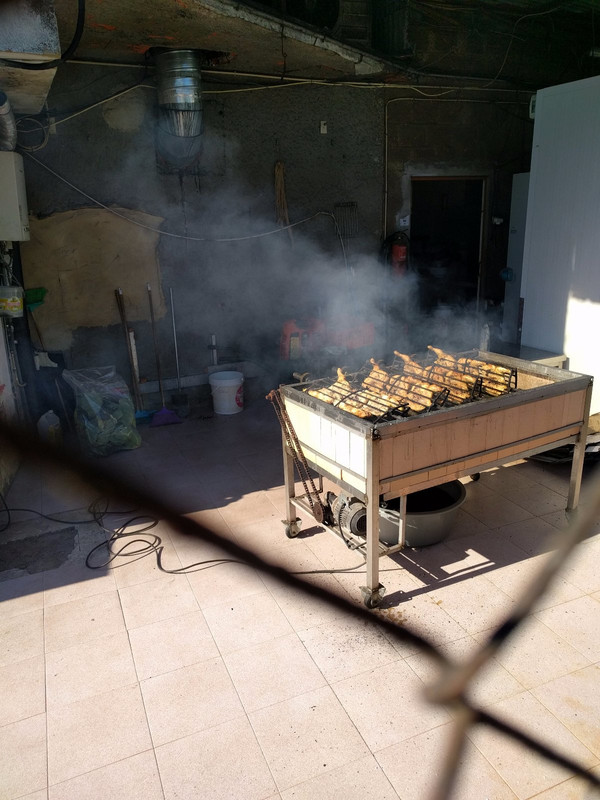 Man roasting chickens - smelled heavenly