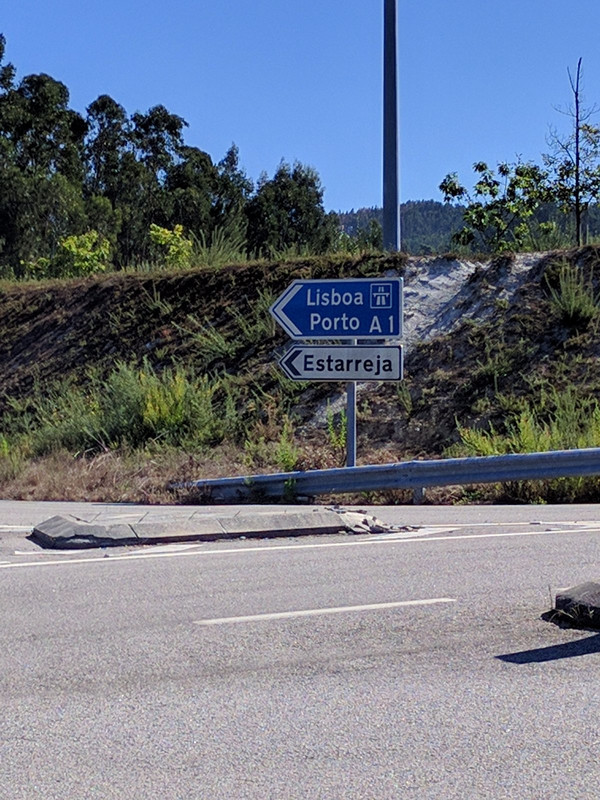 Sign showing road to Lisbon and Porto