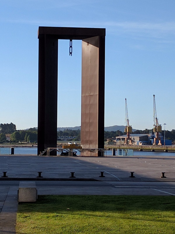 A monument that looks like a boat hoist near harbor