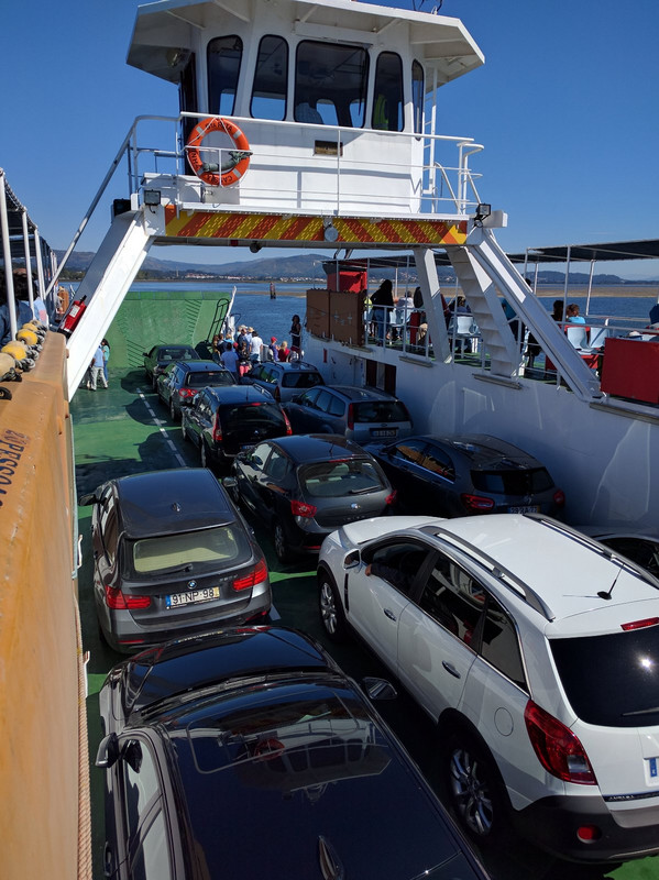 Cars and pilgrims cram onto the ferry