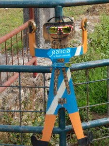 Marionette like figure on fence is also Camino way marker