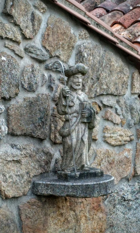 Minature statue of St. James the pilgrim mounted on the building wall
