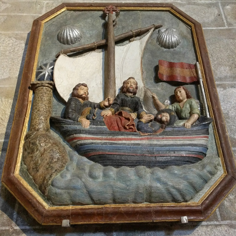 This picture on the wall of the church depicts the disciples of St.James in the boat with his body