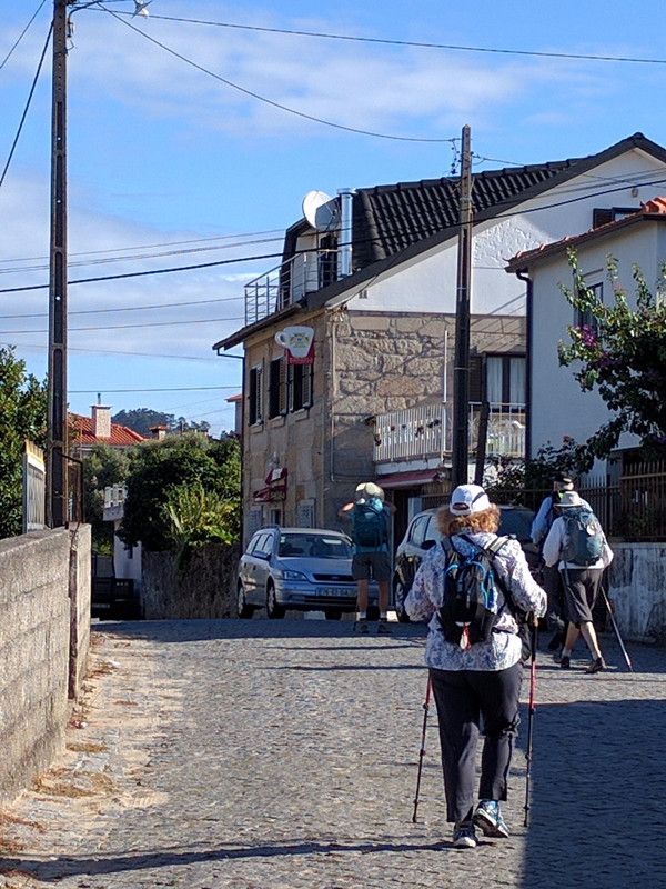 Our merry band walks this cobblestone street 