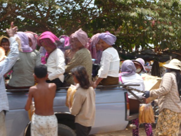 Khmer-scarved women in pick-up 