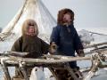 Nenets children by reindeer sledge outside chum, Yamal Peninsula