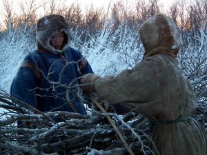 Nenets people loading a sledge with wood, Yamal Peninsula