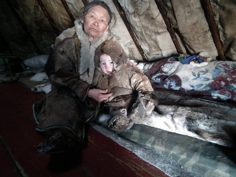 Nenets grandmother and grandson in a chum, Yamal Peninsula, Arctic Siberia