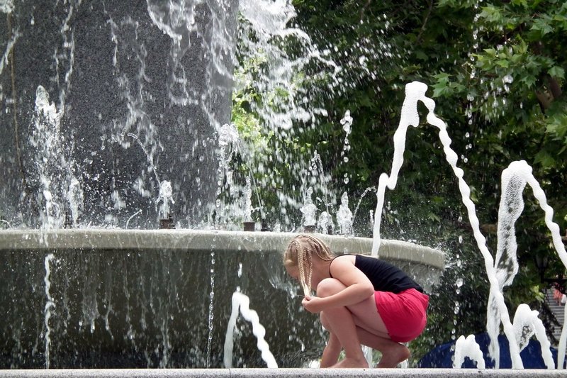 Girl playing by fountain, Sevastopol, Crimea, Ukraine
