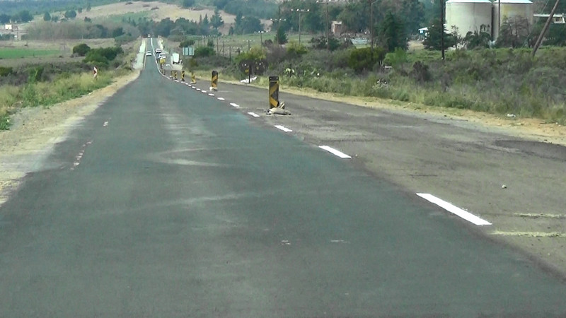 The centre line hand rollered by the road workers