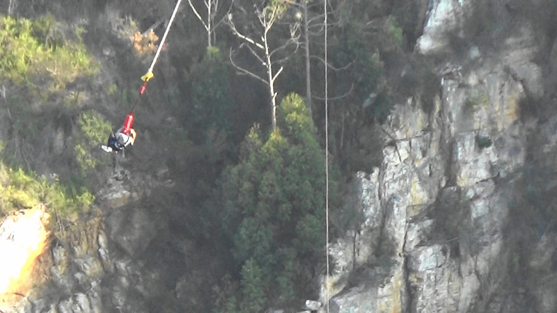 Swinging in mid air 216 metres above the ravine
