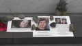 Images of earthquake victims next to their name on the Wall of Rememberance