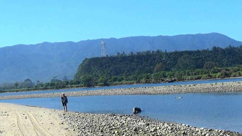 The Karamea River nears the ocean with South Terrace,first European settlemnt, in background