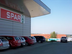 The Interspa store on the outskirts of Pecs with apartment building in the distance