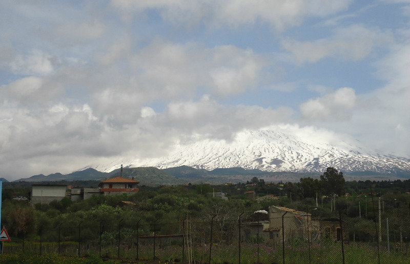 The cloud lifts partially on Mt Etna from near Adrano