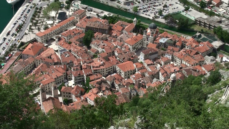The terracotta roofs of the old town below