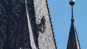 Dangling in the hot sun replacing the tiles on the church spire......whew!