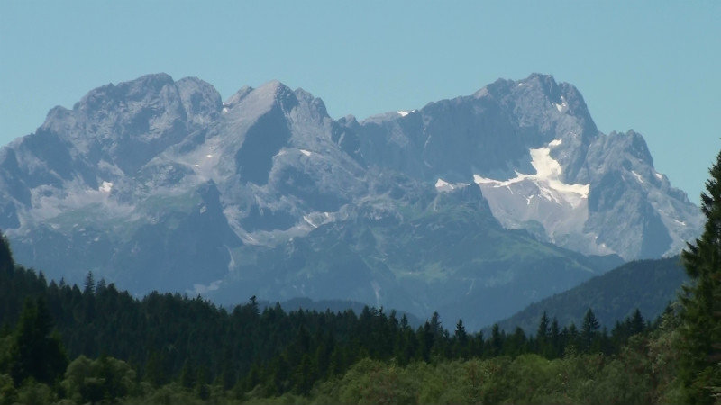 Austrian Alps from riverbed off toll road to border
