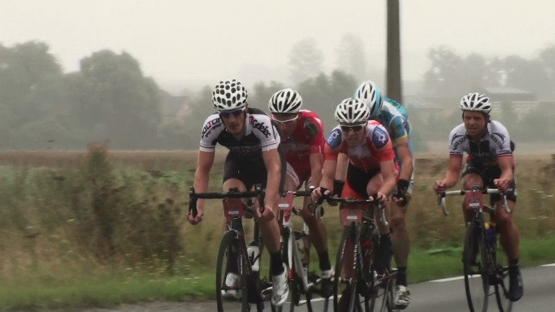 The leading cyclists as we waited on the side of the road to Arras