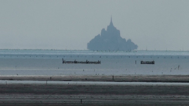Mont Saint-Michel looking ghostly 30km away in the distance