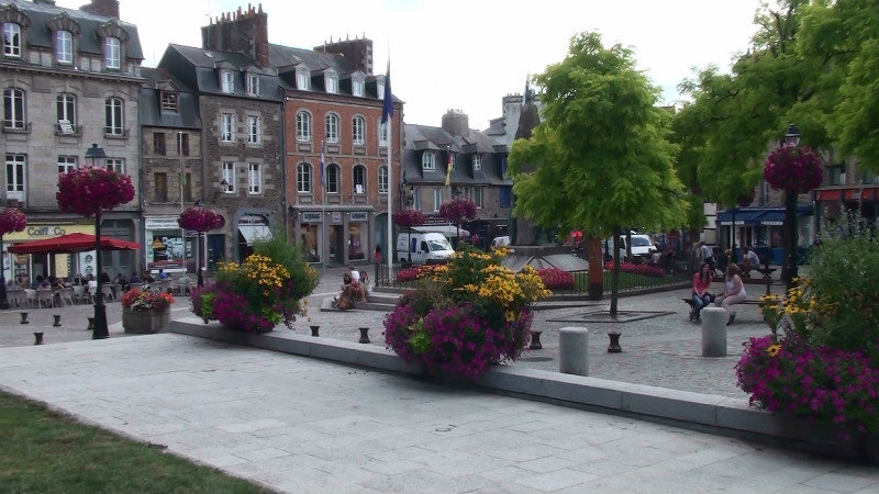 The town square Fougeres.The coourful baskets have been in every town and village,just delightful