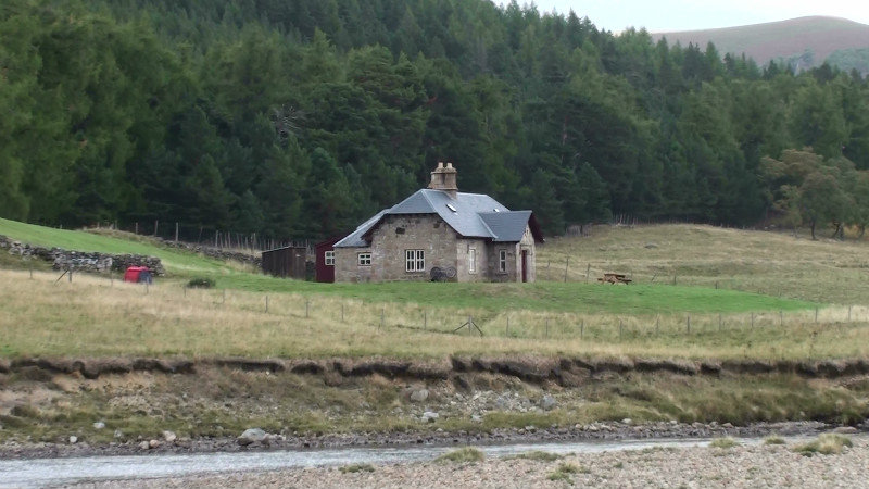 Isolated farmhouse on the other side of the River Dee