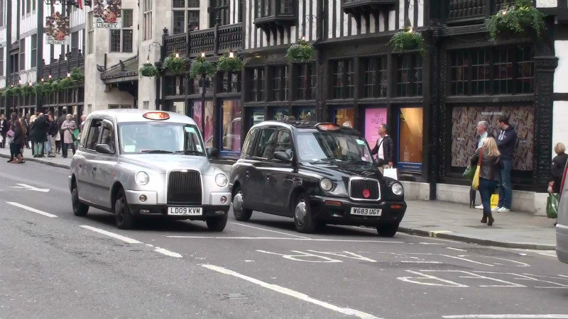 London taxis ready to race each other when the light goes green