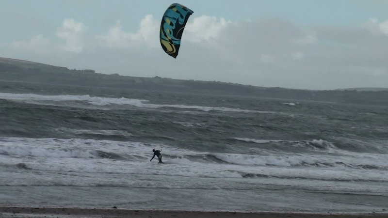 Wind surfers in the cold Atlantic Ocean