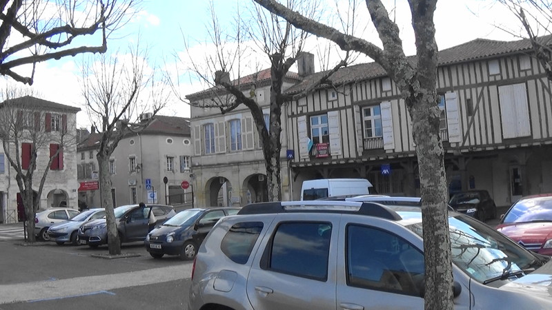Deserted town square at lunchtime,Grenade-sur-l'Adour,except for cars that is.