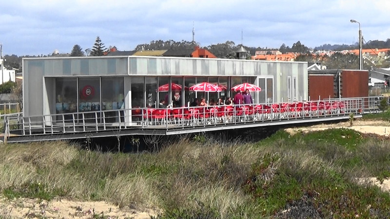 Cafes like this one are dotted along the boardwalk built up above the dune,very green