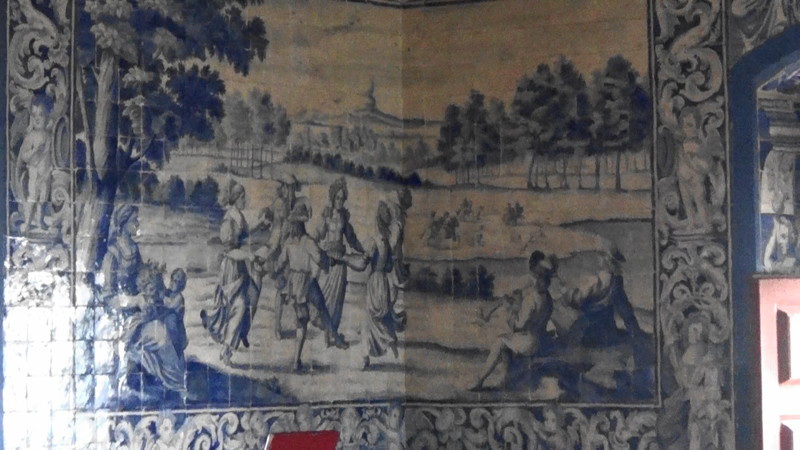 Magnificent blue tiles depicting a story around the room
