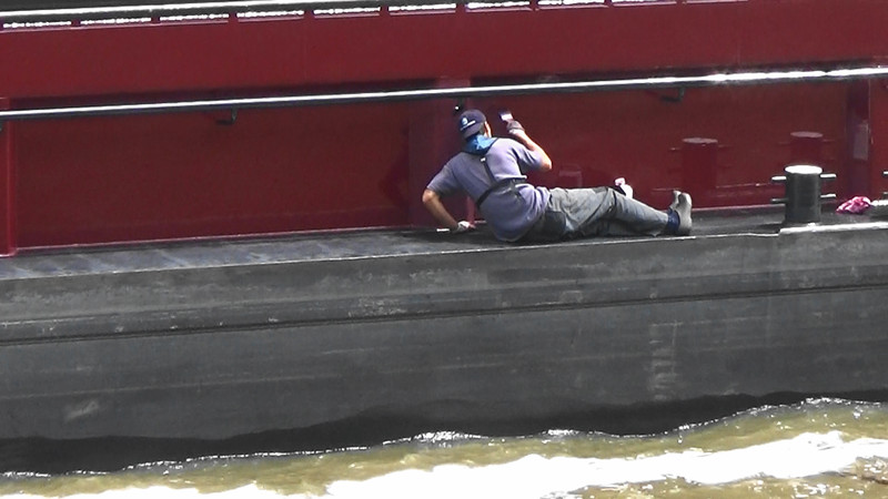 Working away while the barge enters the lock.Note no harness!