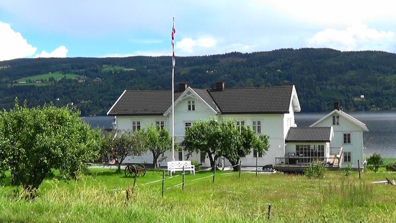 House and orchard on the fjord