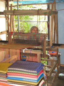 Weaver behind her loom