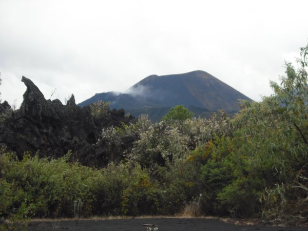 The Paricutin Volcano with smoke and lava in the foreground
