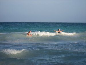 Karin and Elliott in the waves