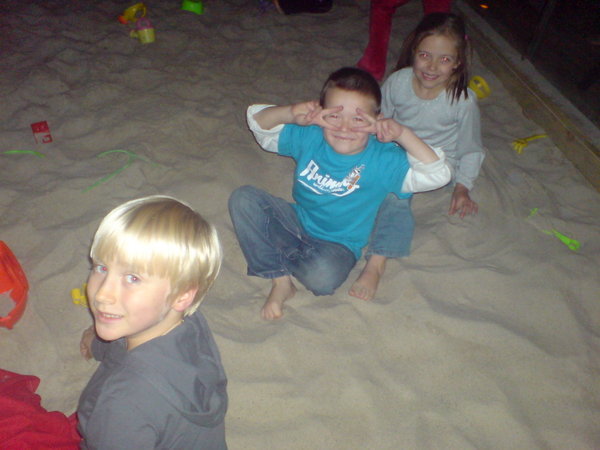 Sophie, William and Finn in the sandpit