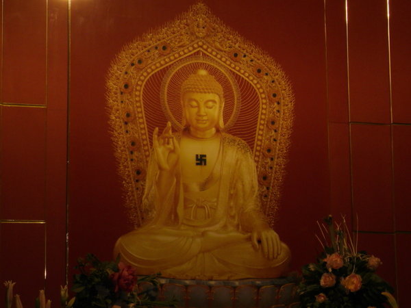 Buddha with a swastika, but it's not the same apparently, 