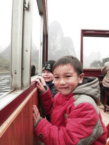 The boys enjoying the ride along the Li River